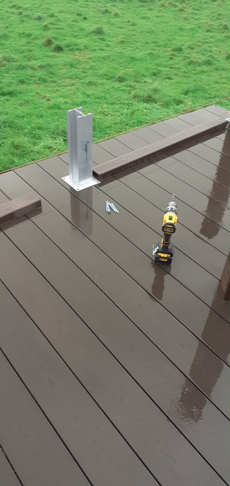 Professional composite decking installation work in progress in Anglesey