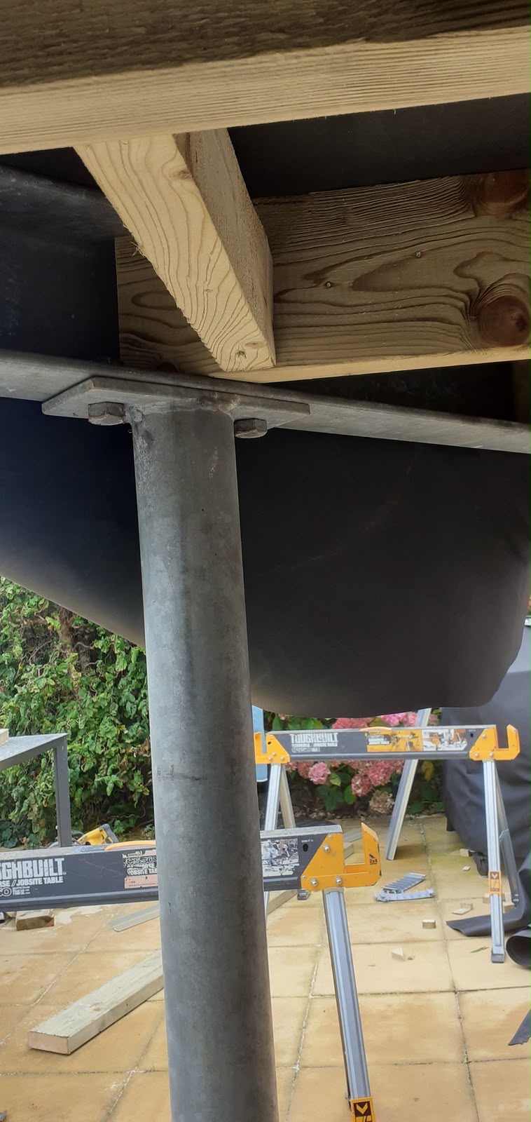 Heavy duty steel posts and timber subframe construction for elevated deck