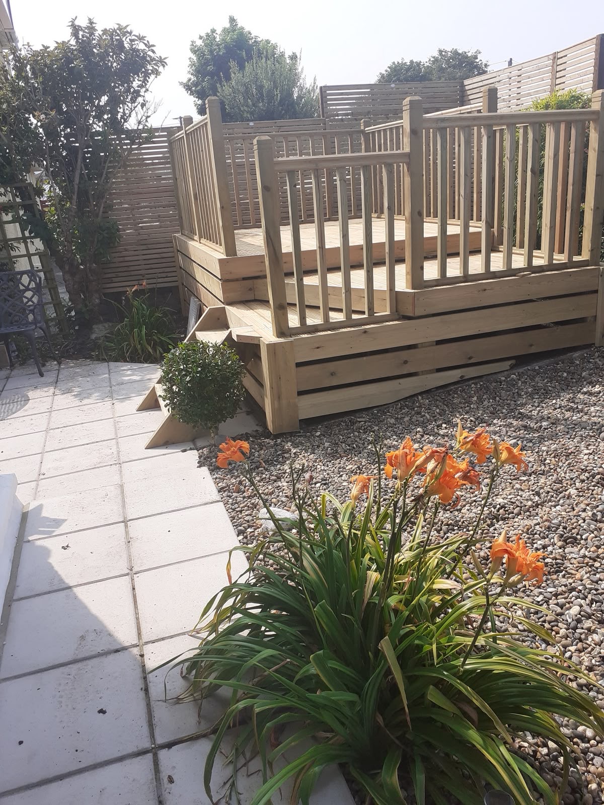 Featured multi-level timber decking and slatted fencing project in Anglesey by Rhys Williams Decking and Fencing